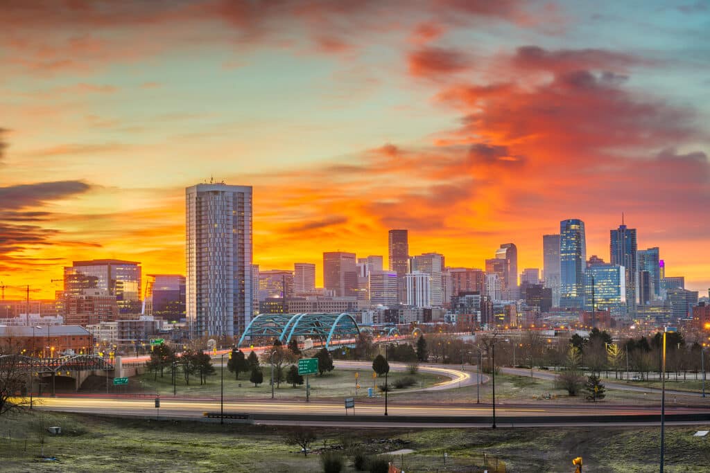 Denver, Colorado, USA downtown city skyline at dawn.